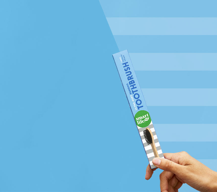 Biodegradable bamboo toothbrush with charcoal-infused ultra-soft bristles.
